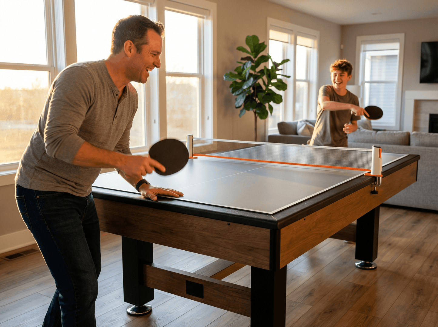 Two men playing ping pong in a living room.
