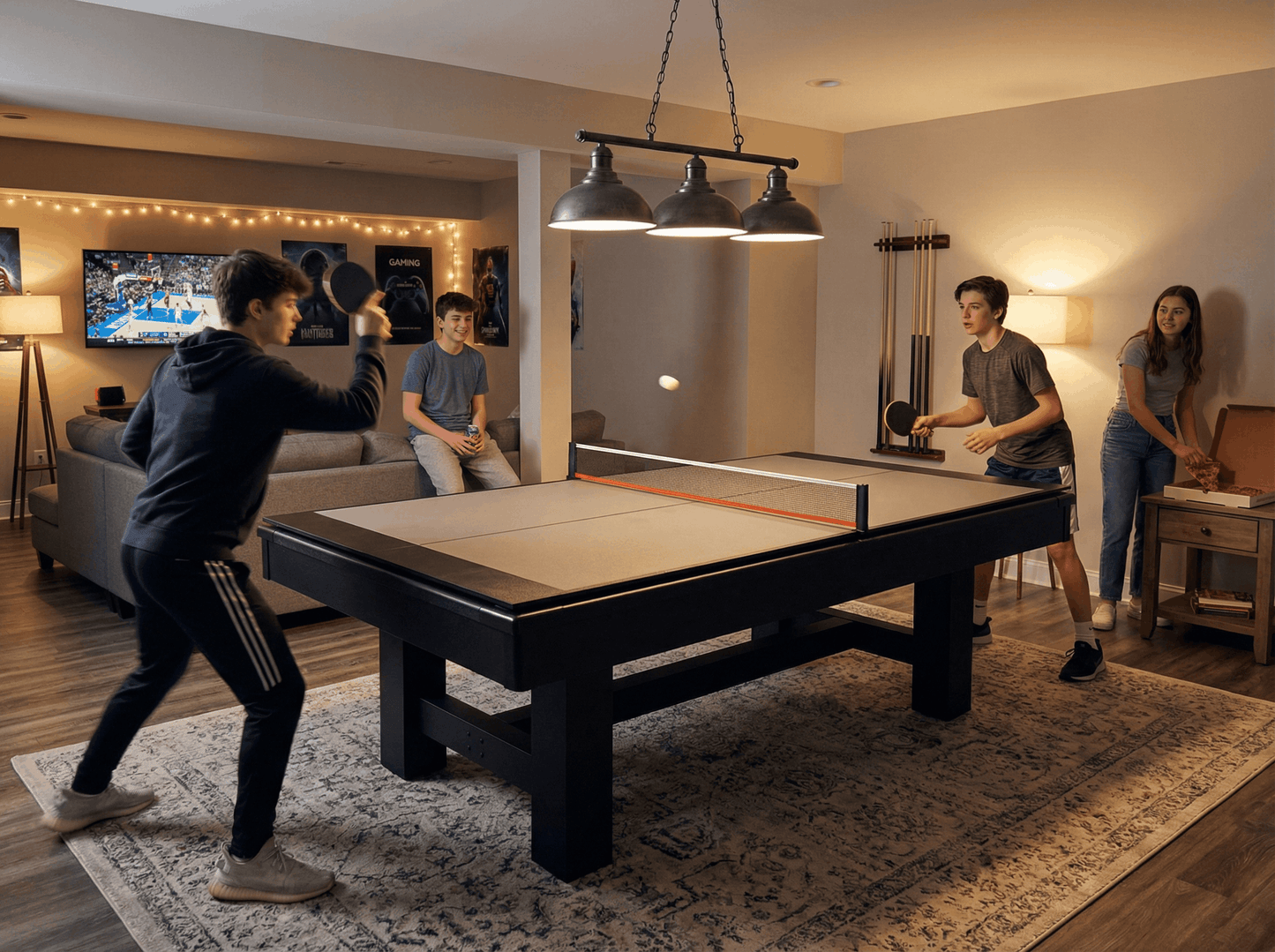 Four people playing ping pong in a living room with a TV in the background.