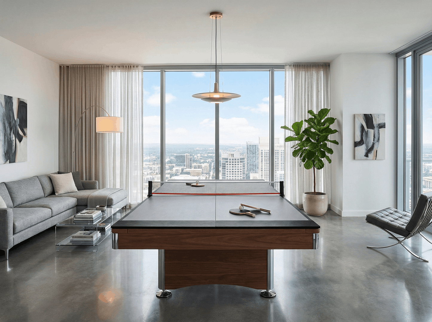 Modern living room with a pool table and city view