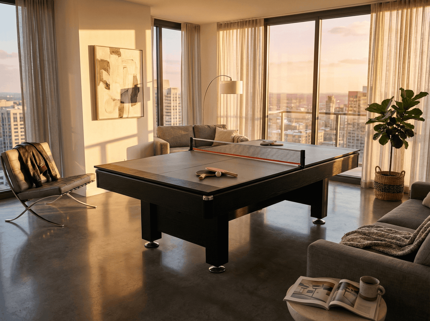 Modern living room with a pool table and cityscape view