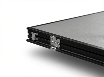 Close-up of the metal hinges on a folded ping pong conversion-top half