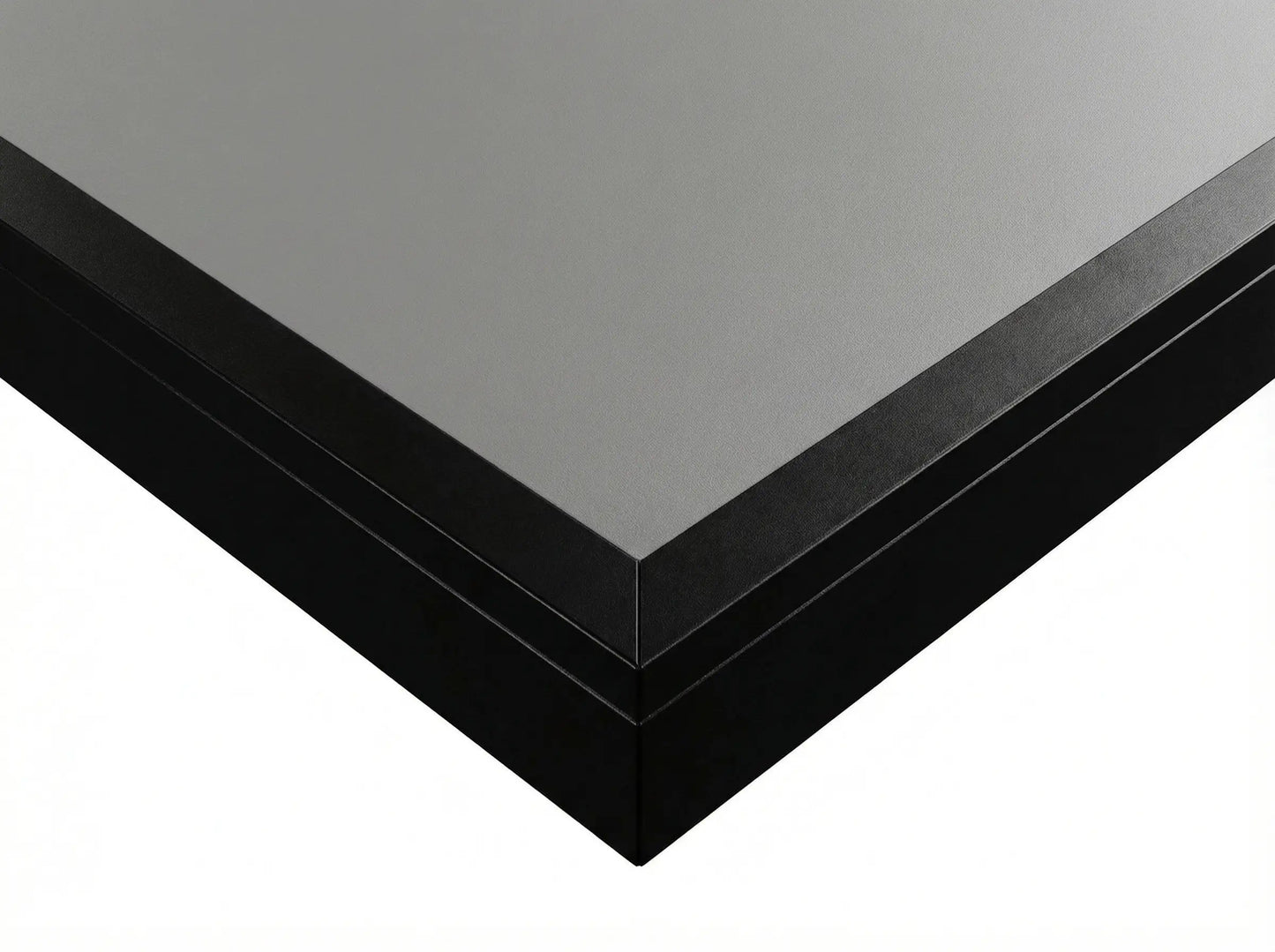 Close-up of the gray engineered-wood playfield and black finished edge