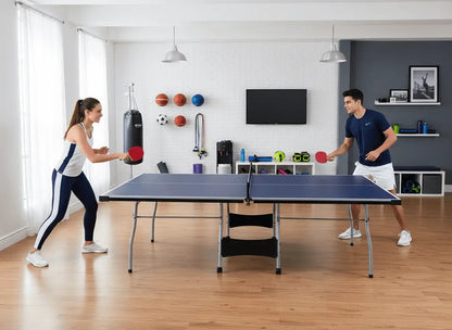 Two adults playing table tennis on a full-size indoor ping pong table in a home gym