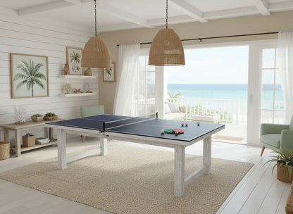 Full-size blue ping pong conversion top in a bright coastal-style indoor game room
