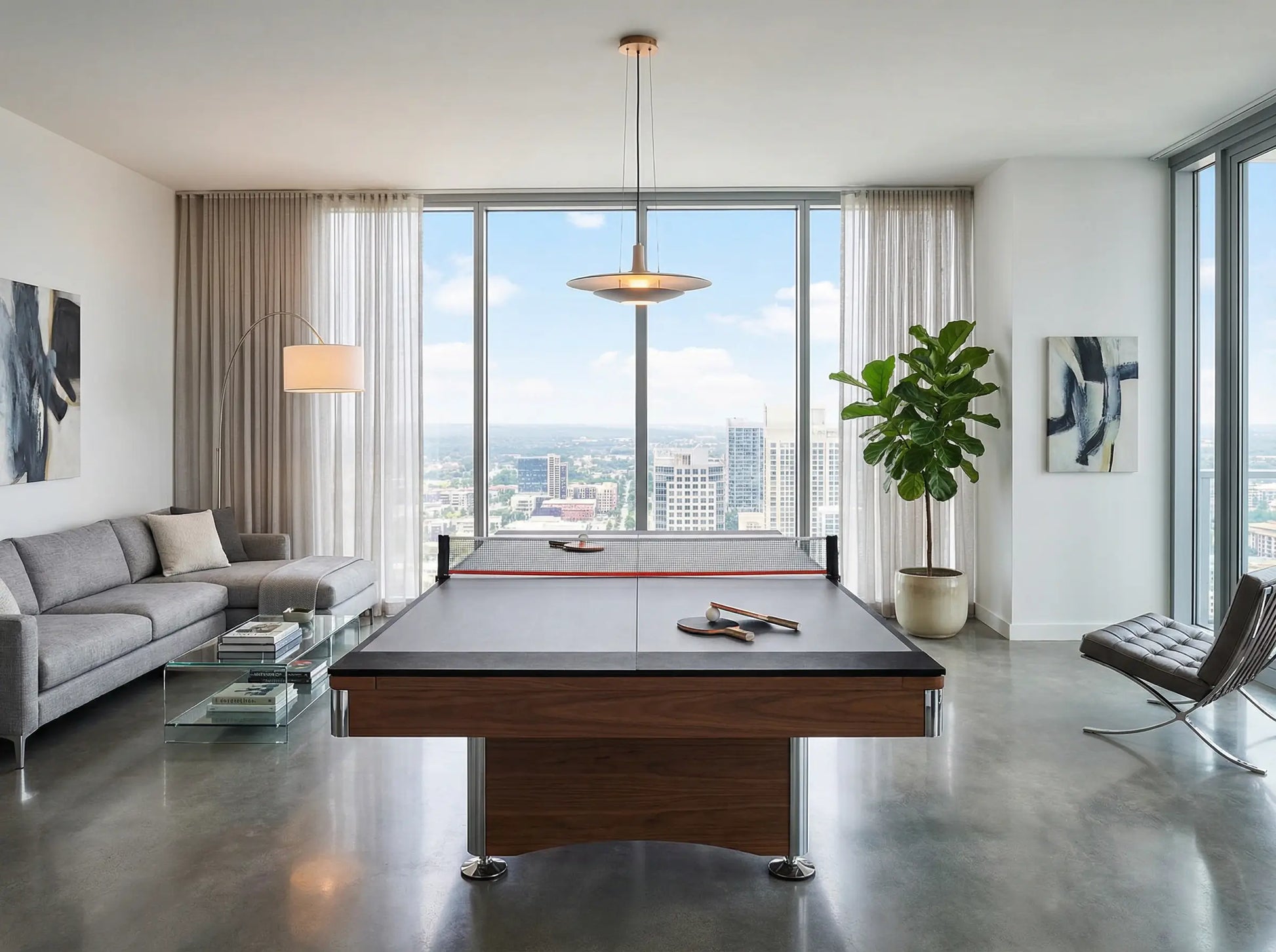 Ping pong conversion top installed over a pool table in a modern high-rise apartment