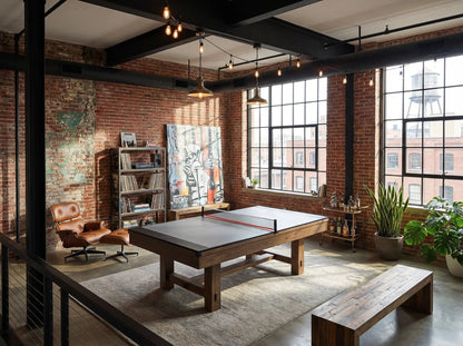 Gray ping pong conversion top installed on a pool table in an industrial loft game room